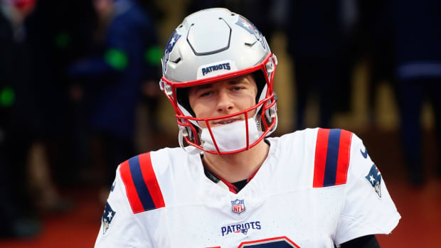 New England Patriots quarterback Mac Jones walks out to the field prior to the game against the Buffalo Bills at Highmark Stadium.